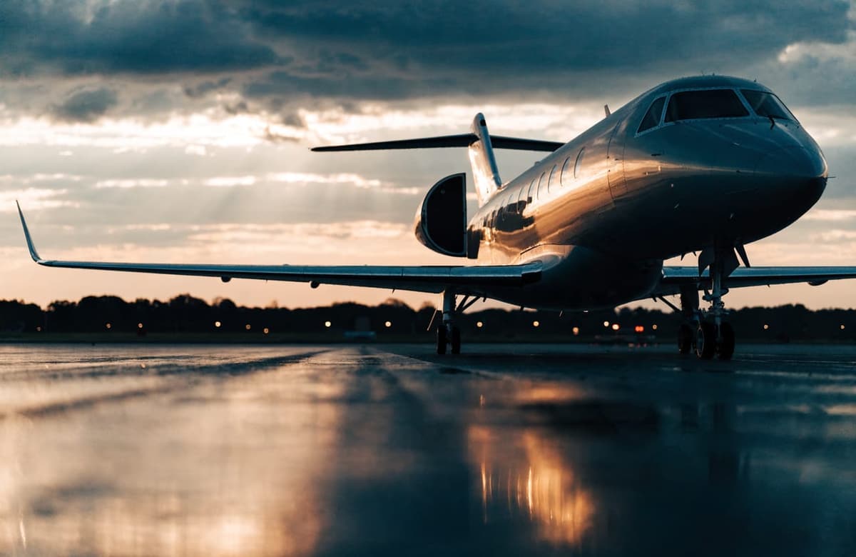 Private jet on the tarmac at dusk